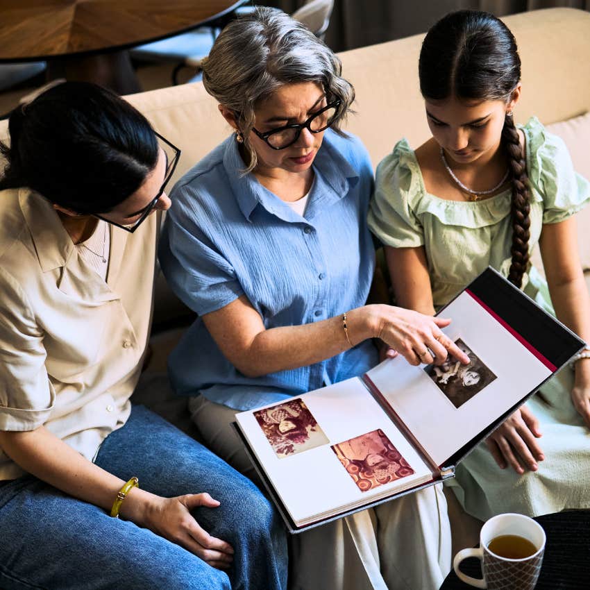 older woman preserving family heirlooms with her child and grandchild