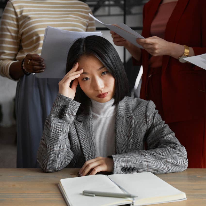 annoyed young woman hearing your generation doesn't want to work anymore from boomers in the office