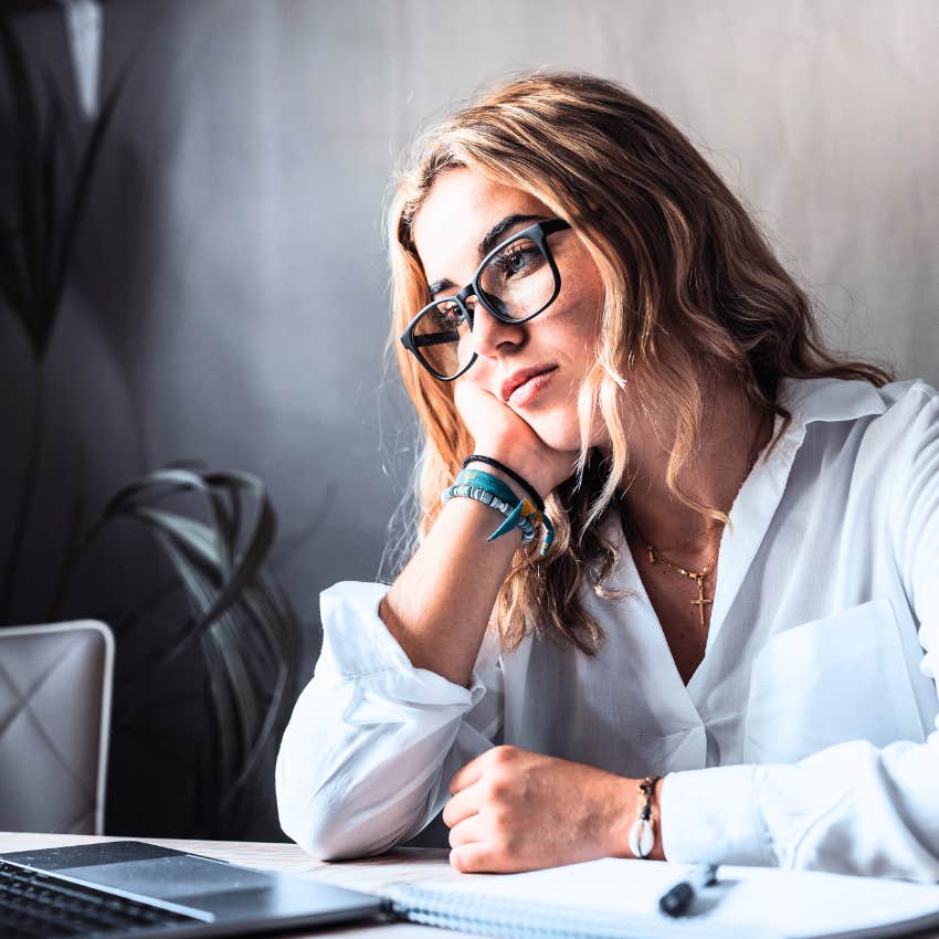 young woman feeling stressed out at work