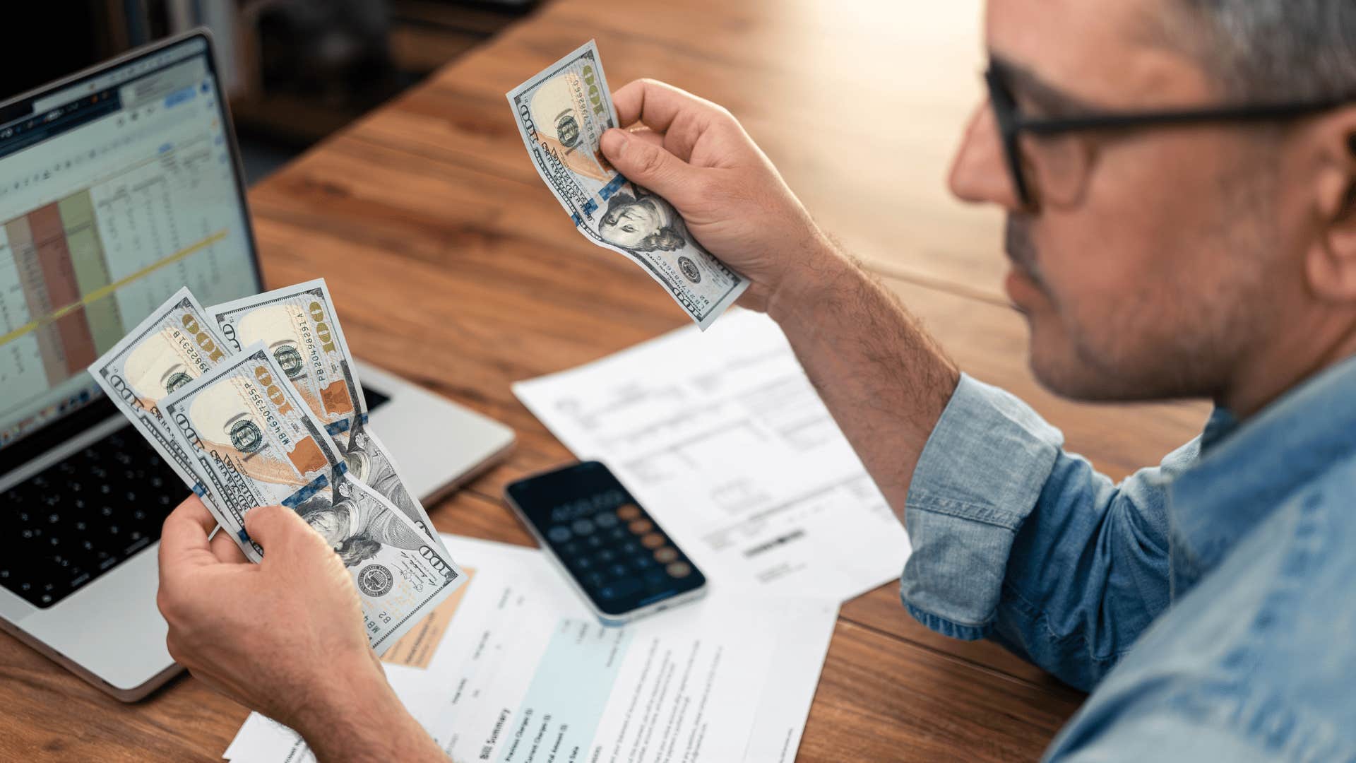 middle aged man worrying about money