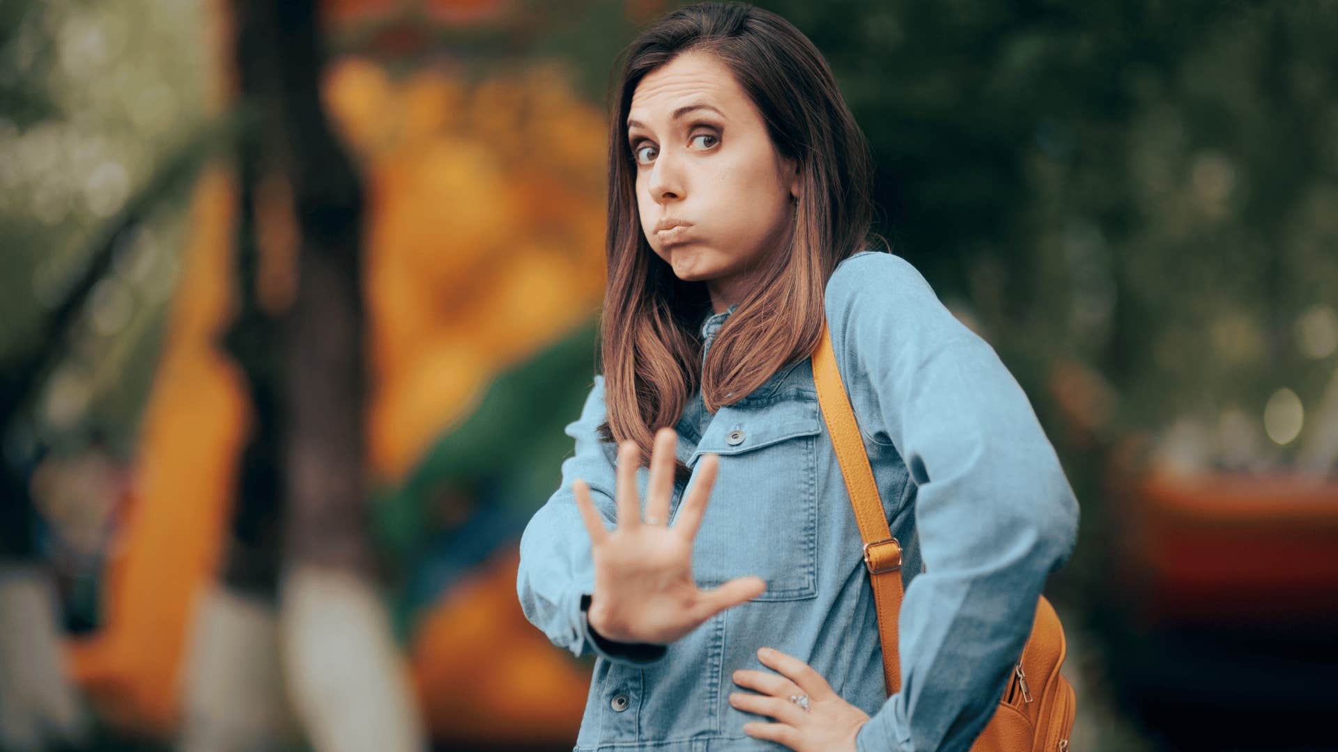 woman holding up hand saying nah i'm good