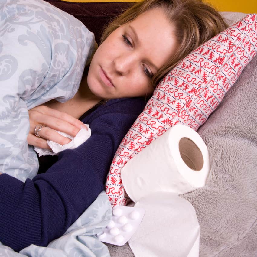 woman having a tough time crying next to tissues