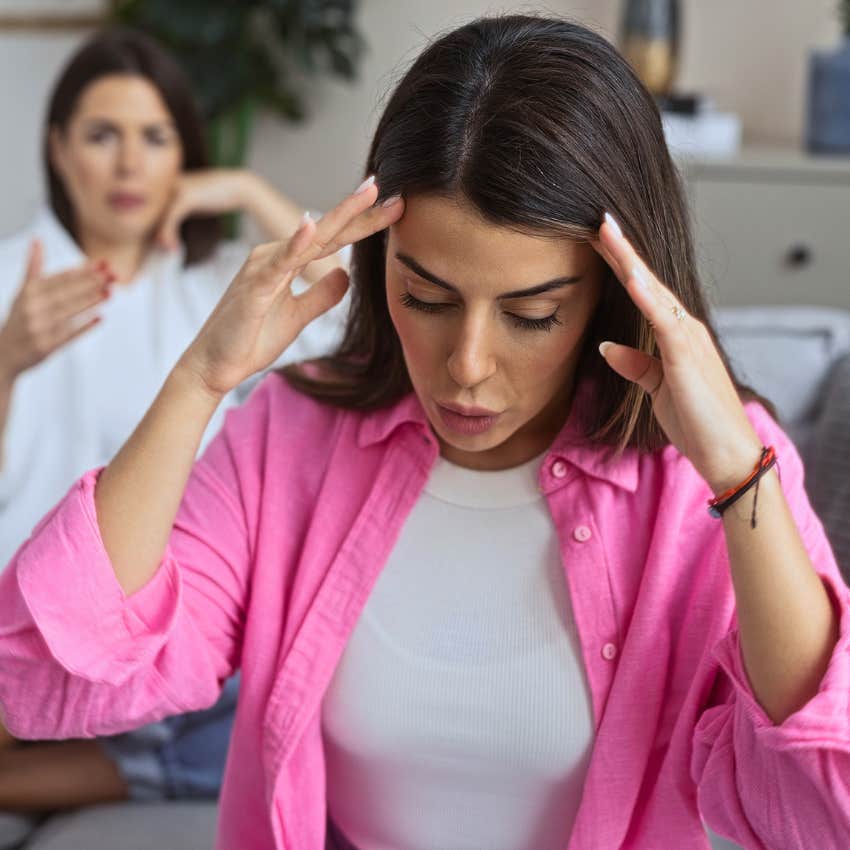 Woman avoiding accountability at home with a friend