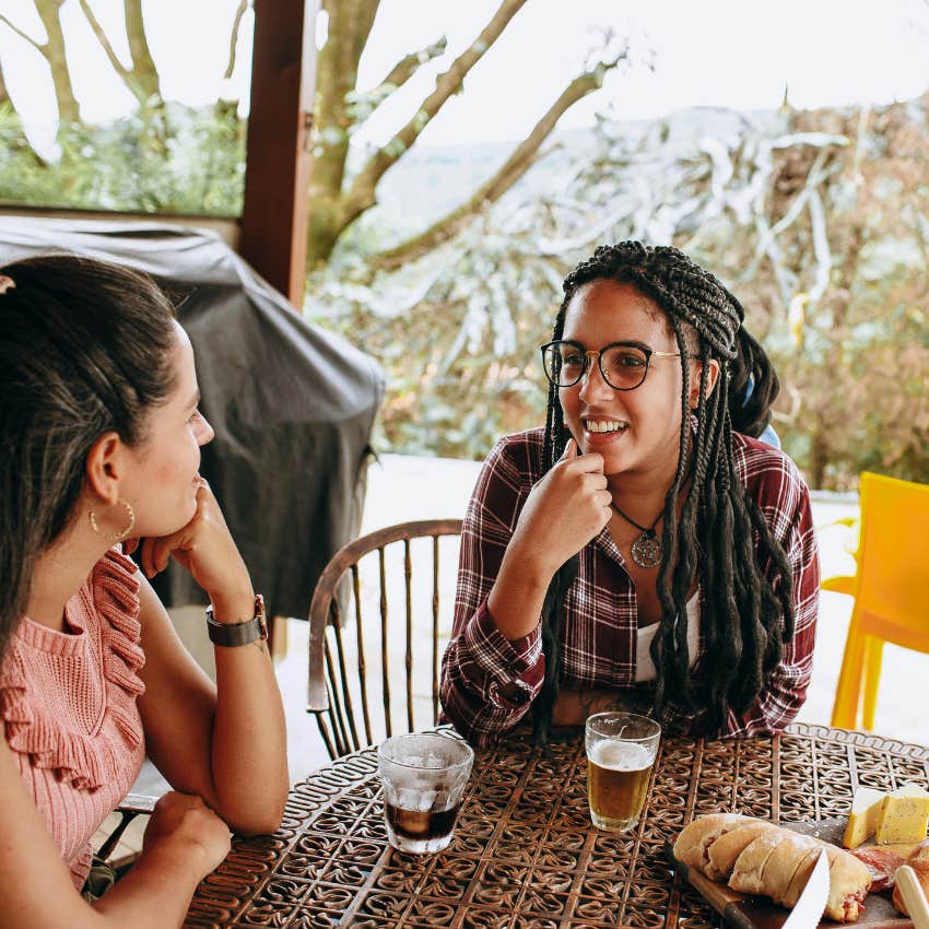 emotionally radiant woman saying that makes sense to her friend
