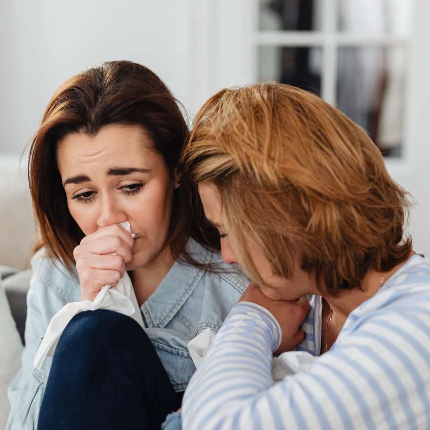 really hurt woman crying to her friend