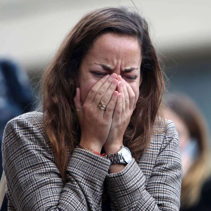 woman ignoring her emotions and trying not to cry