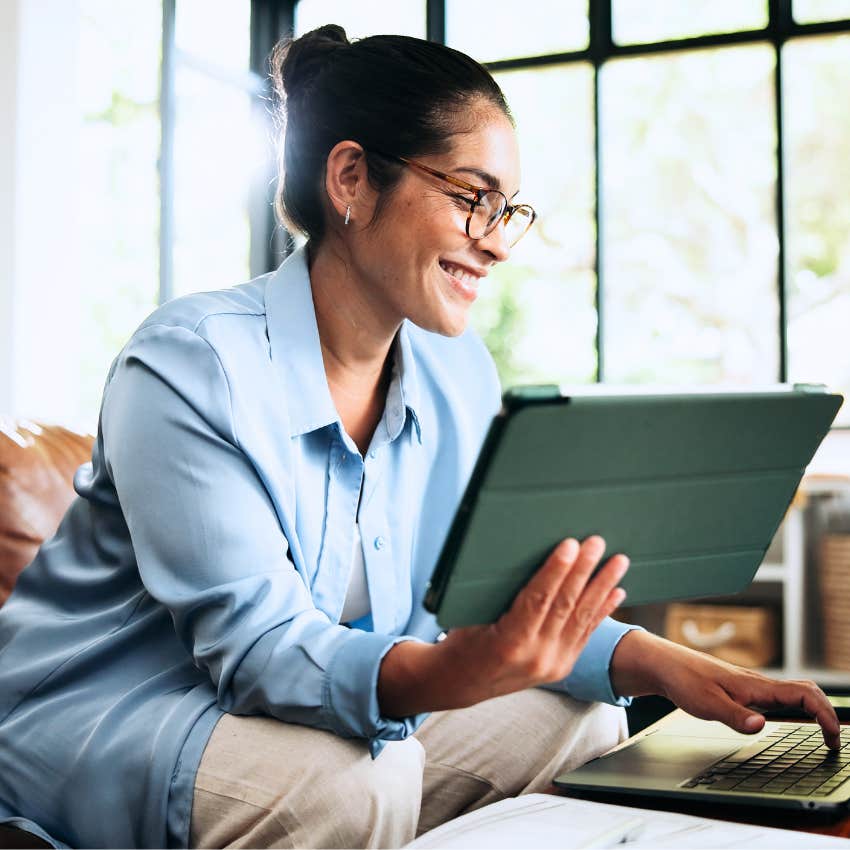 Effortlessly creative woman planning on her laptop at home.