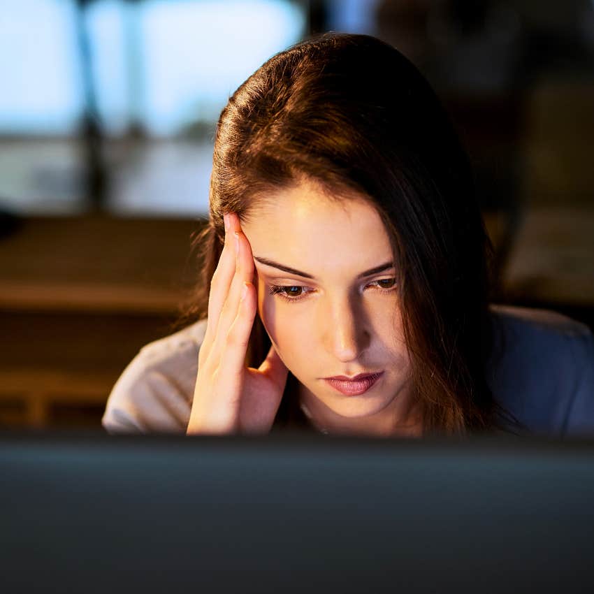 Woman who's a procrastinator sitting in her office.