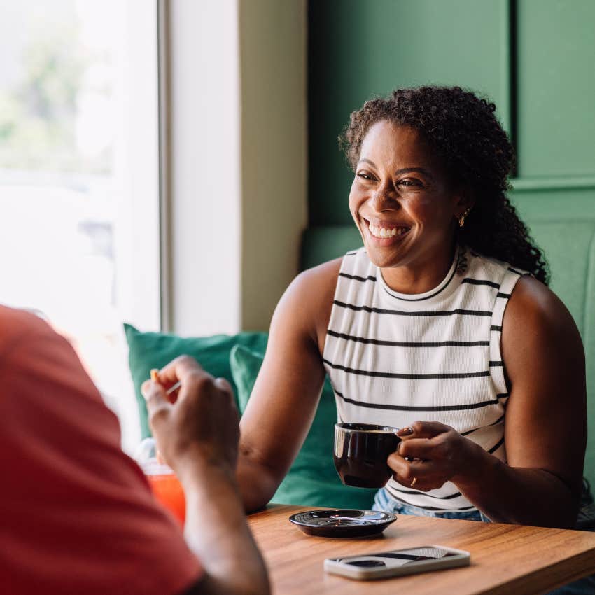 woman who knows her voice and opinions matter smiling on a date