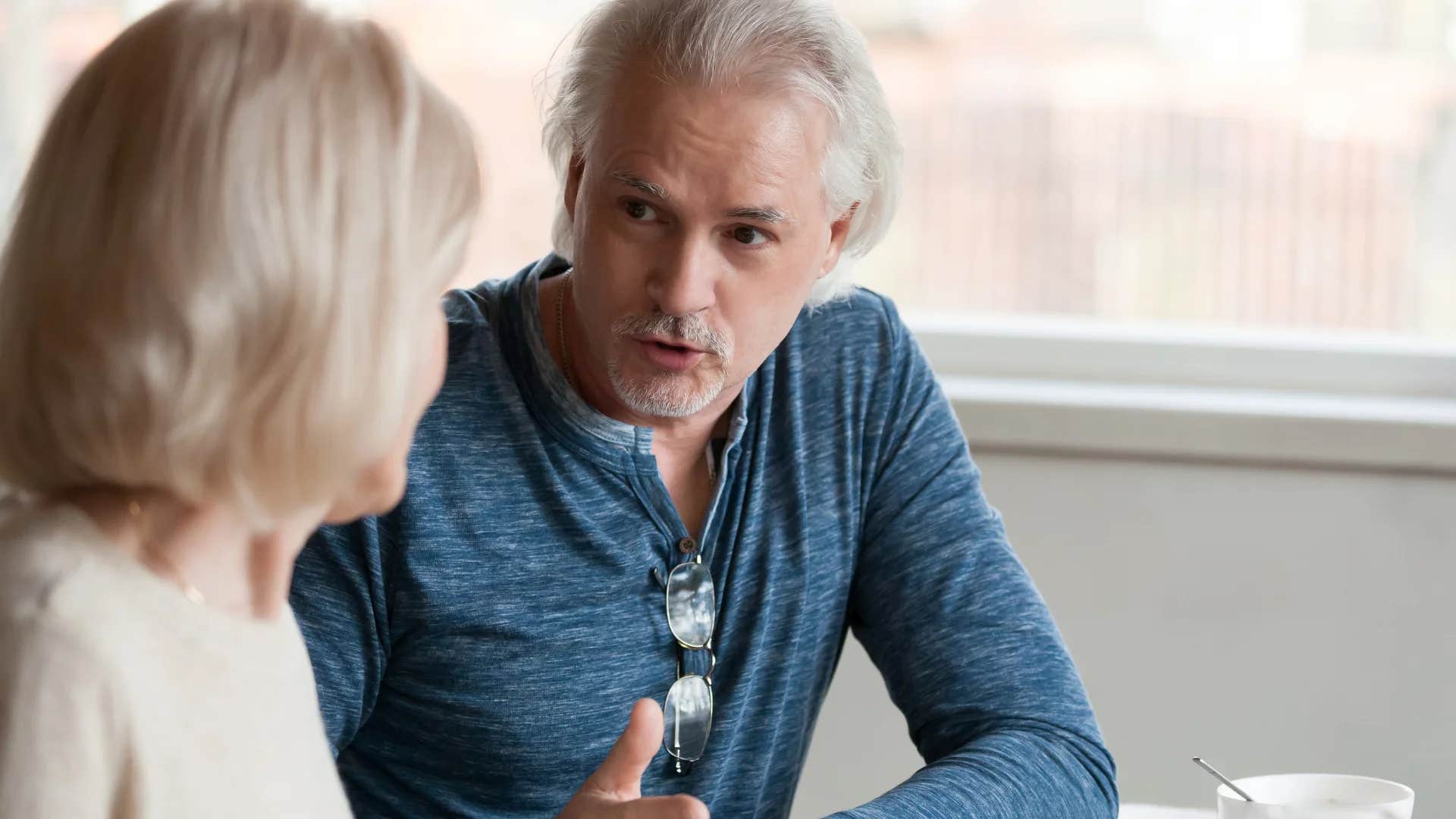 man bragging to his colleague about his goals