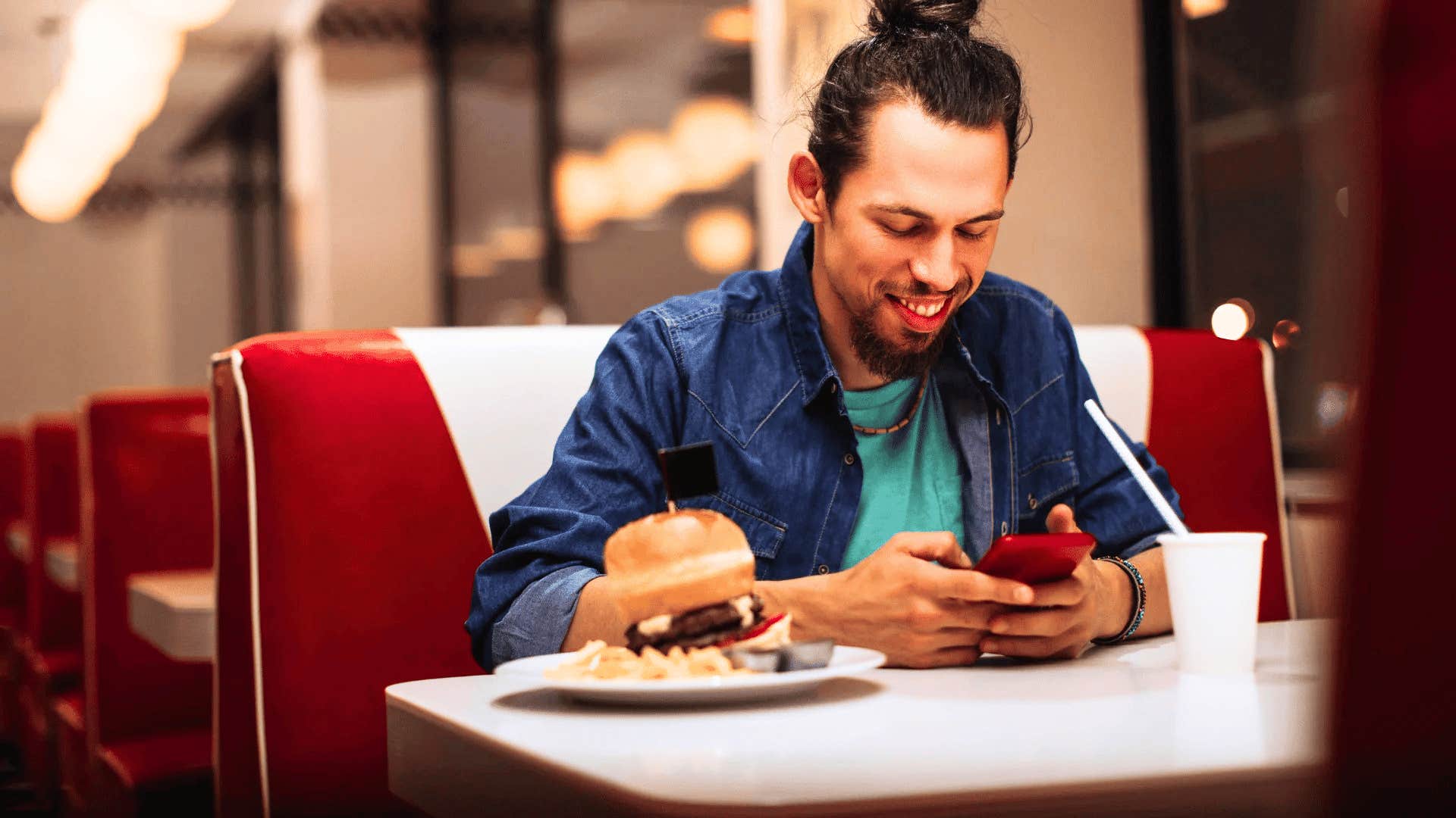 happy man eating alone to boost his creativity