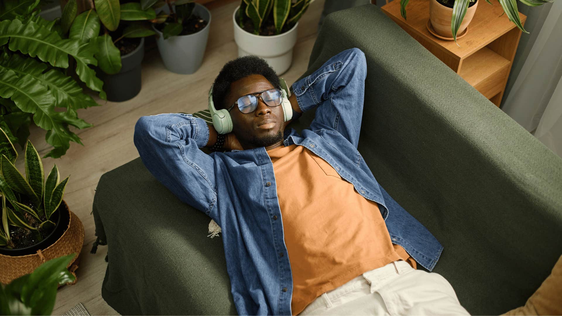 man relieving his stress relaxing alone at home