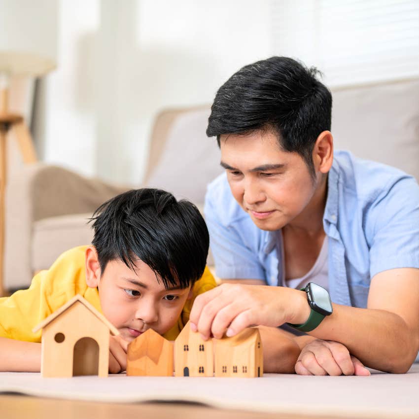 man deconstructing and rebuilding toys with his dad
