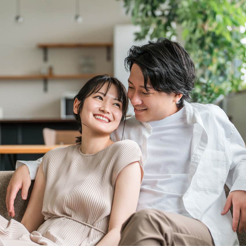happy couple cuddling man making partner feel safe