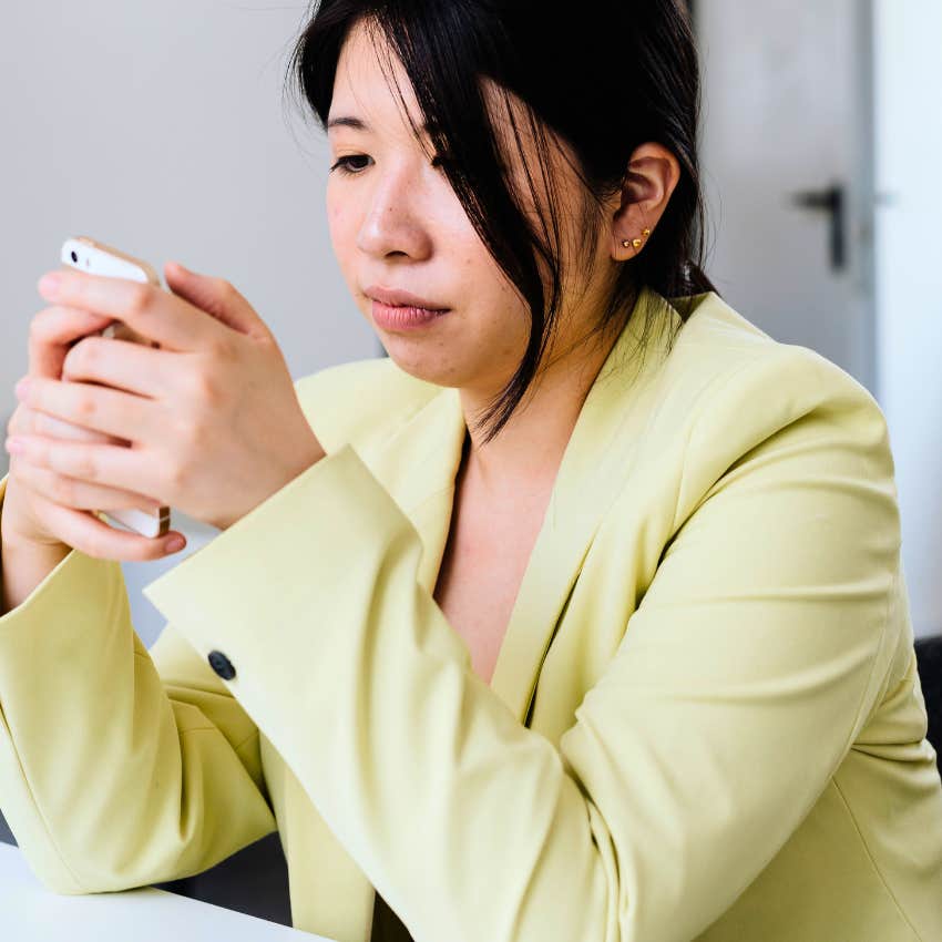 annoyed professional woman sending polite email to colleague