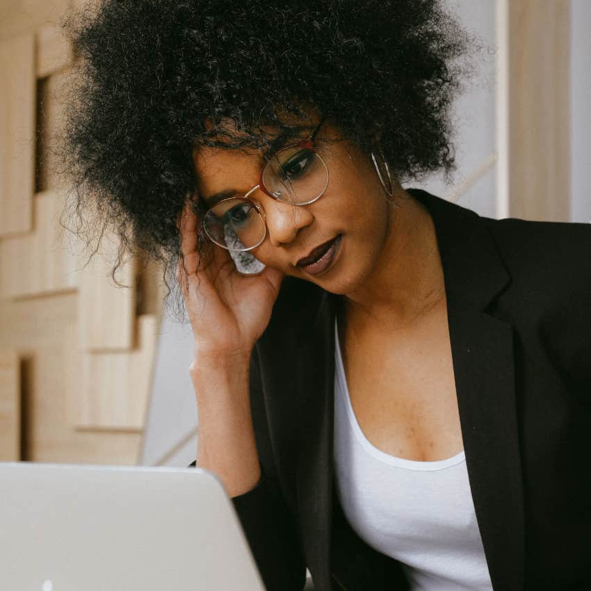 frustrated worker sending email to colleague