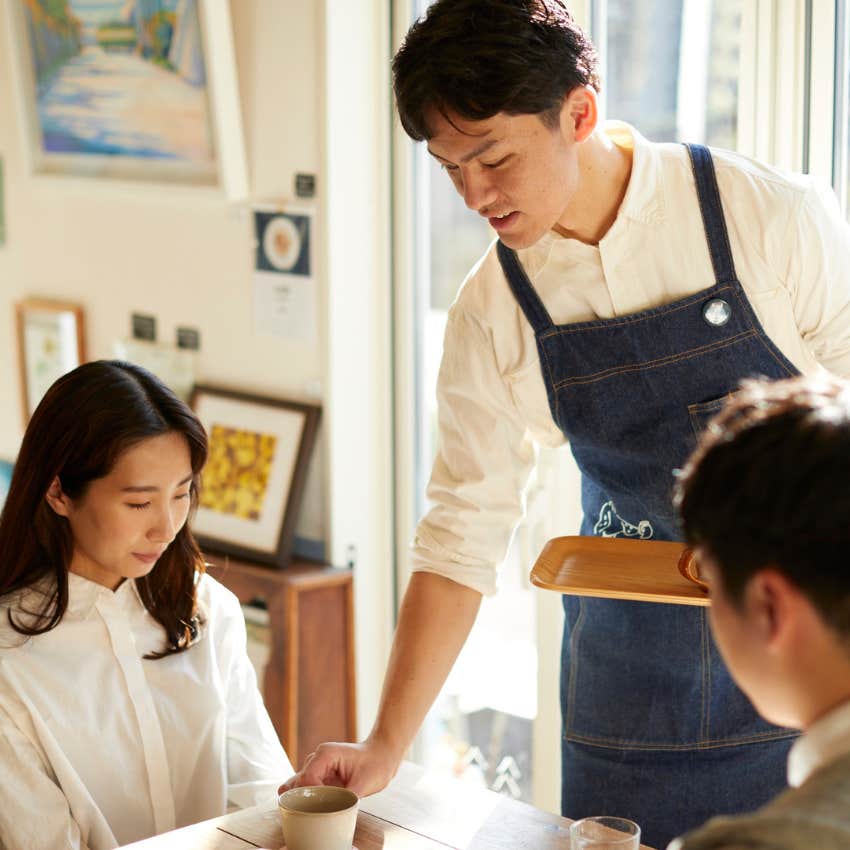 waiter providing service to his customer