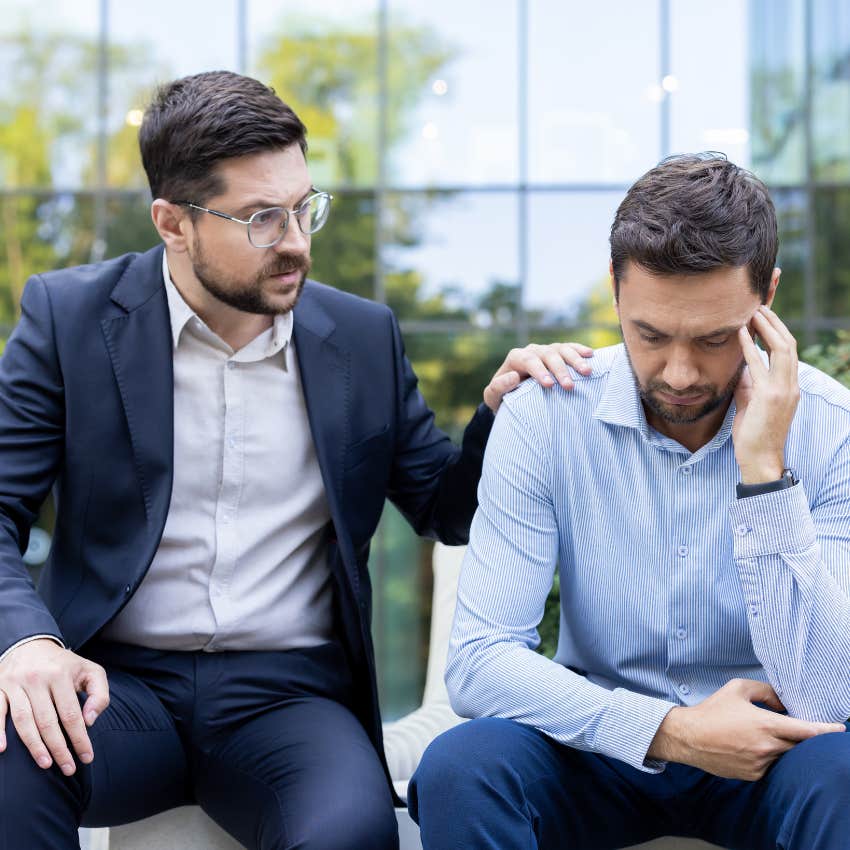 emotionally intelligent man comforting colleague saying we'll get through it