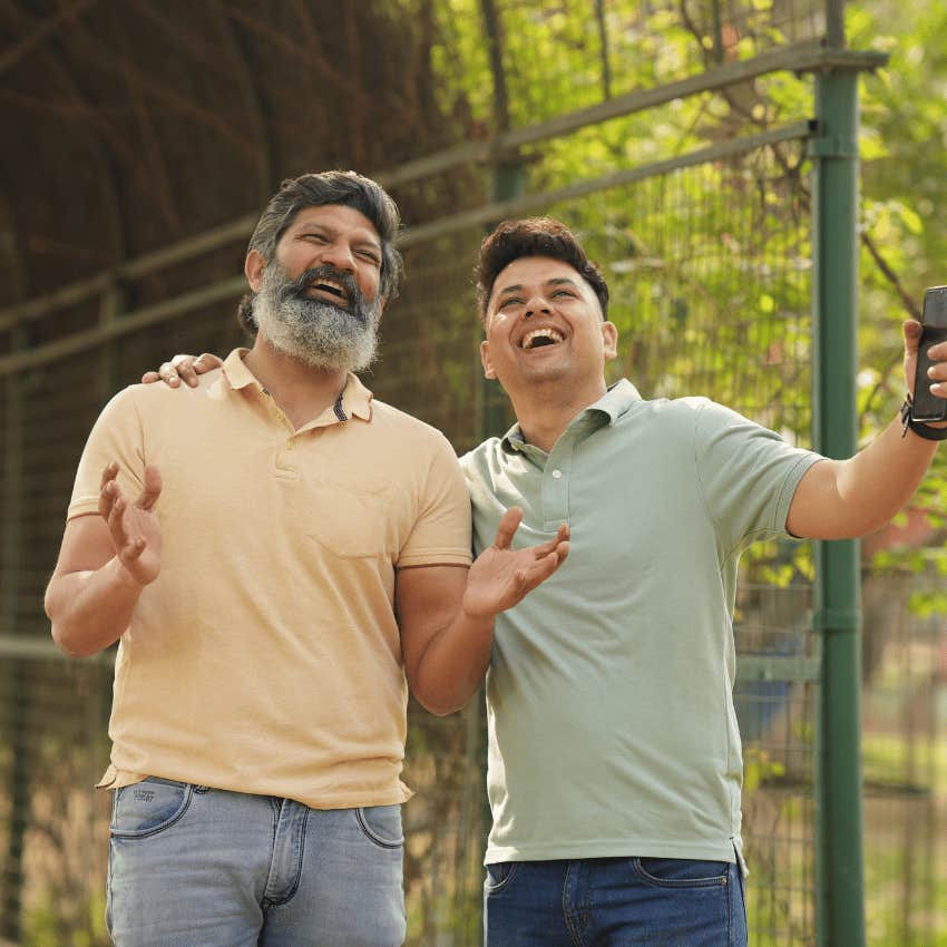 man pretending to be happy telling his friend don't worry about me