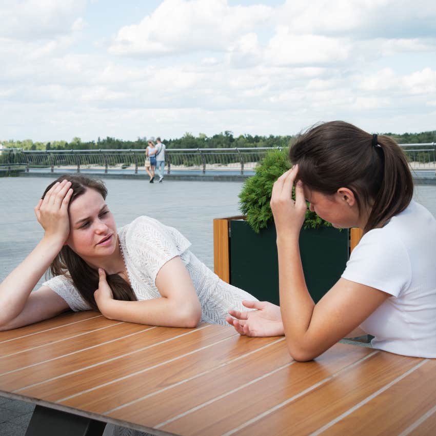 clingy woman asking friend if she likes her other friends more