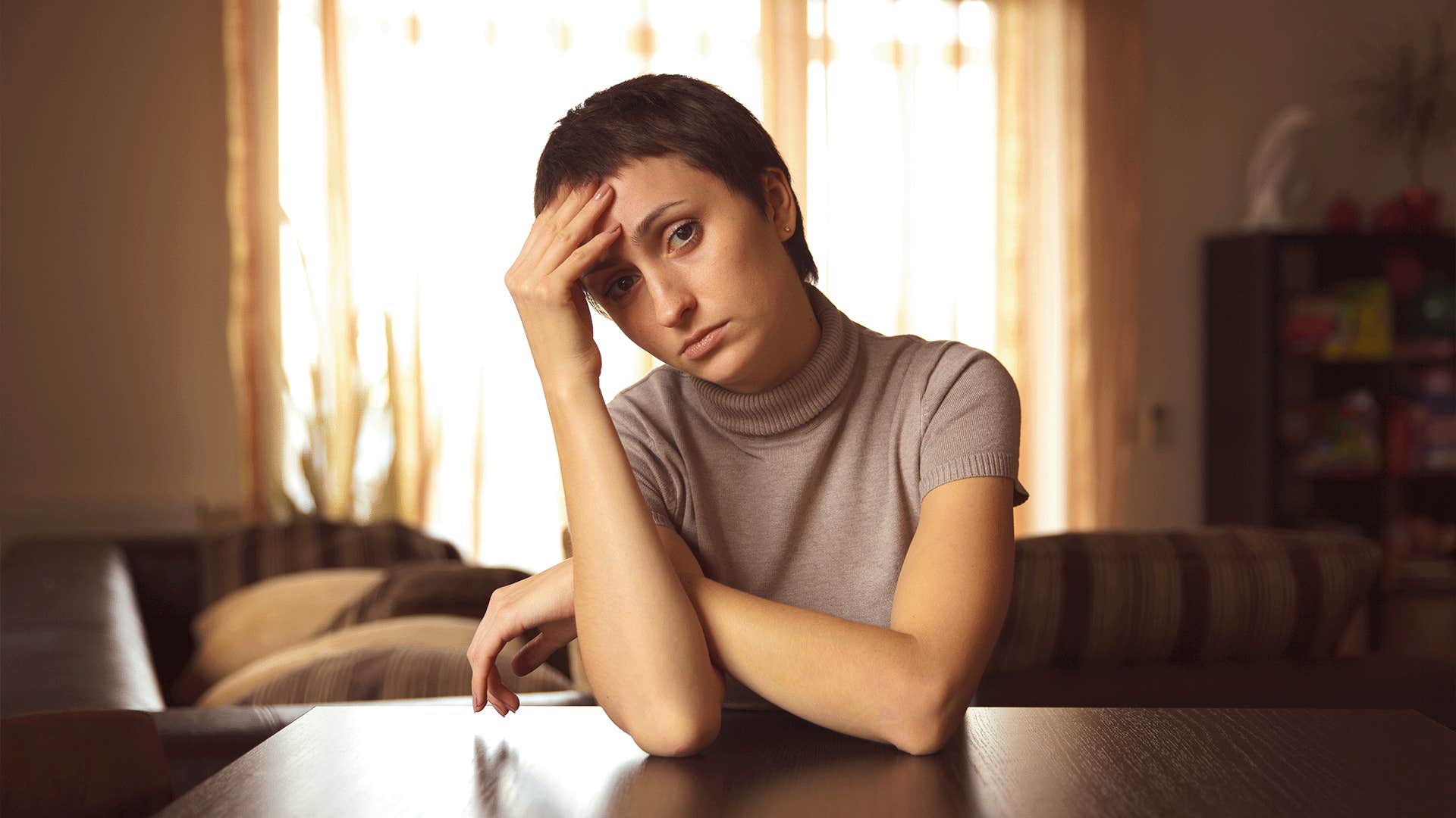 mentally and emotionally numb woman says 'I just need to get through this week'