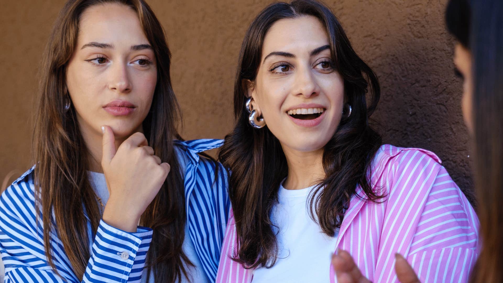 authentic women listening to conversation saying that's incredible