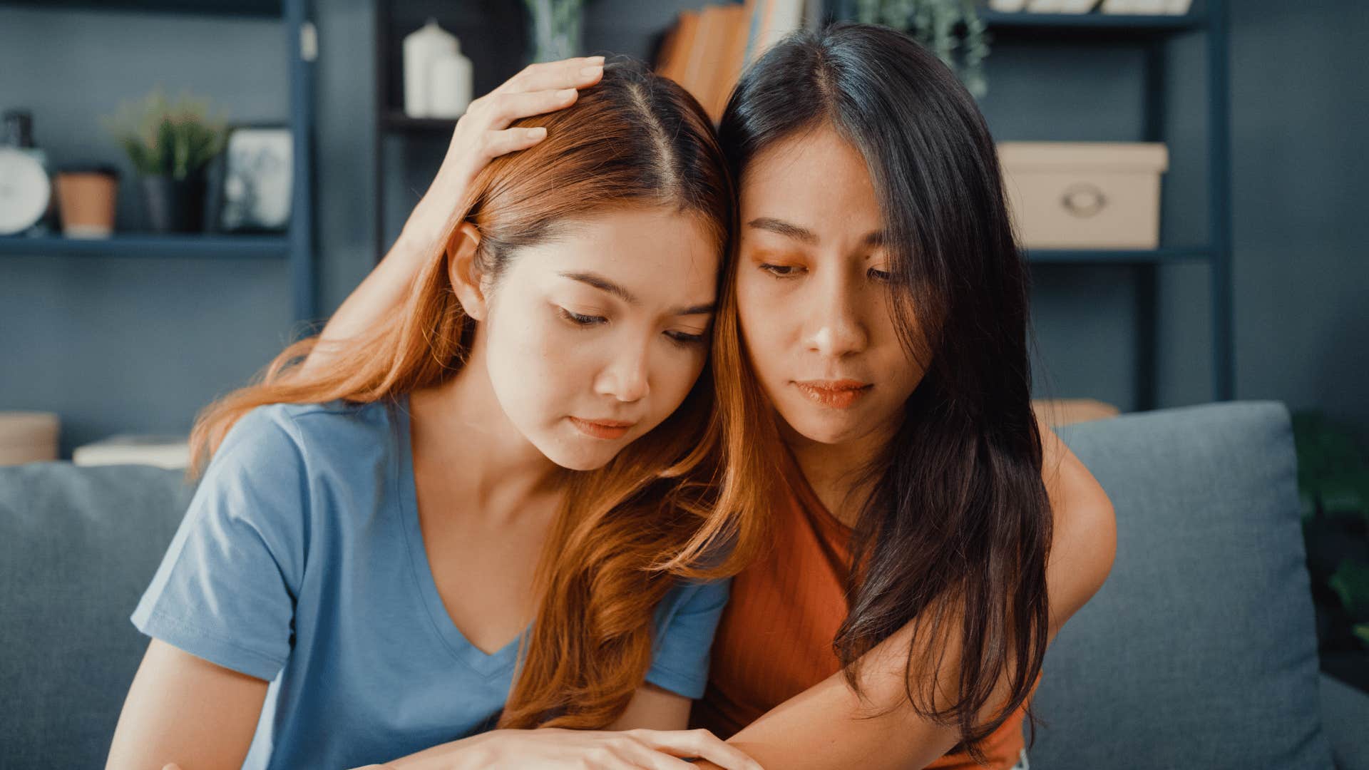 friends hugging comforting each other