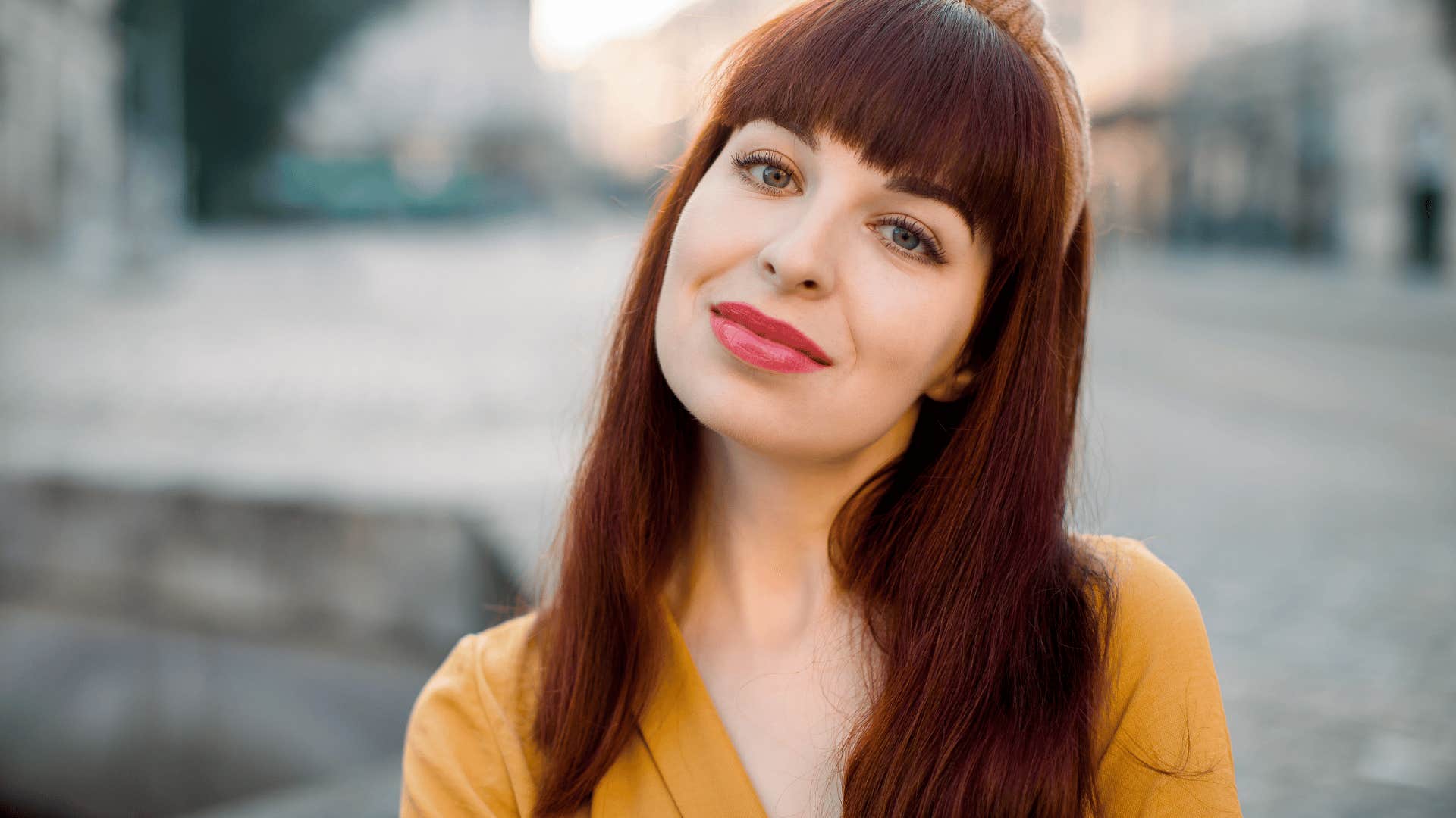 woman smiling even though she's overwhelmed