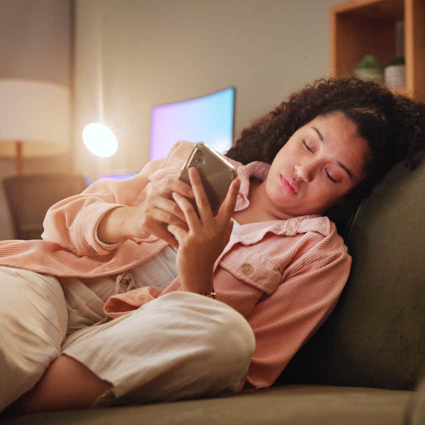 tired woman with no guilt texting friends she is just not up for it when canceling plans