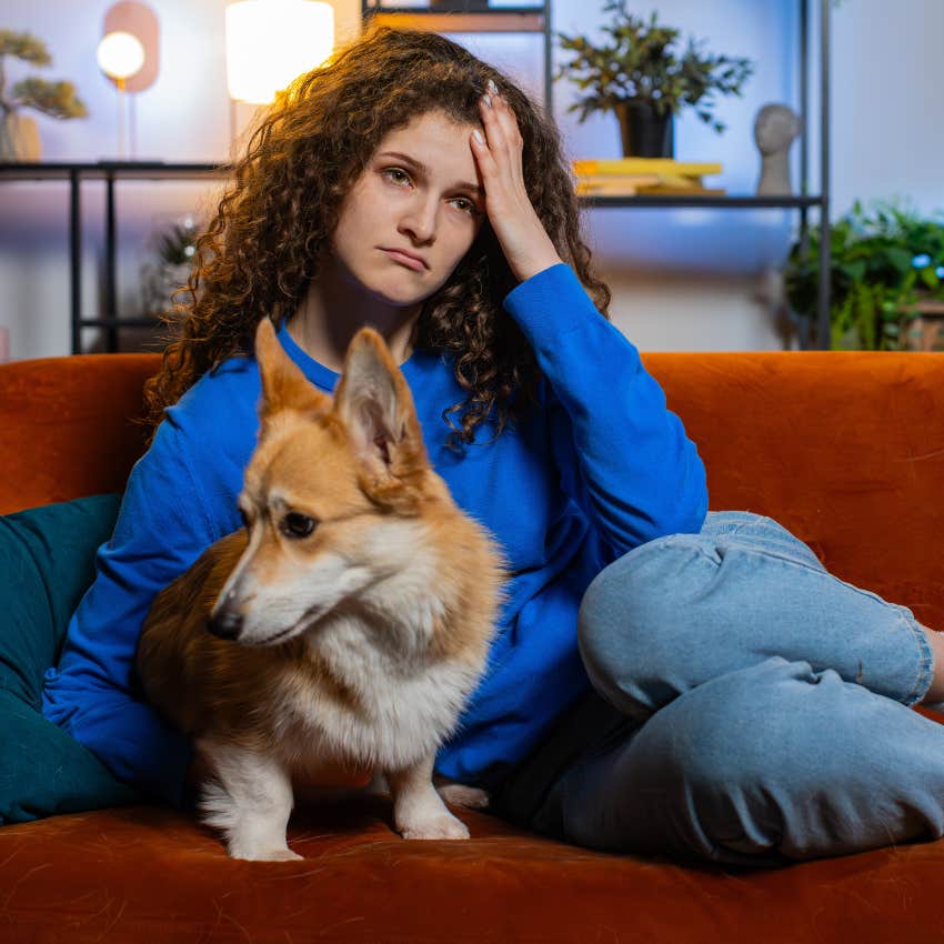 woman suffering from burnout sitting with dog asking why is everything going wrong