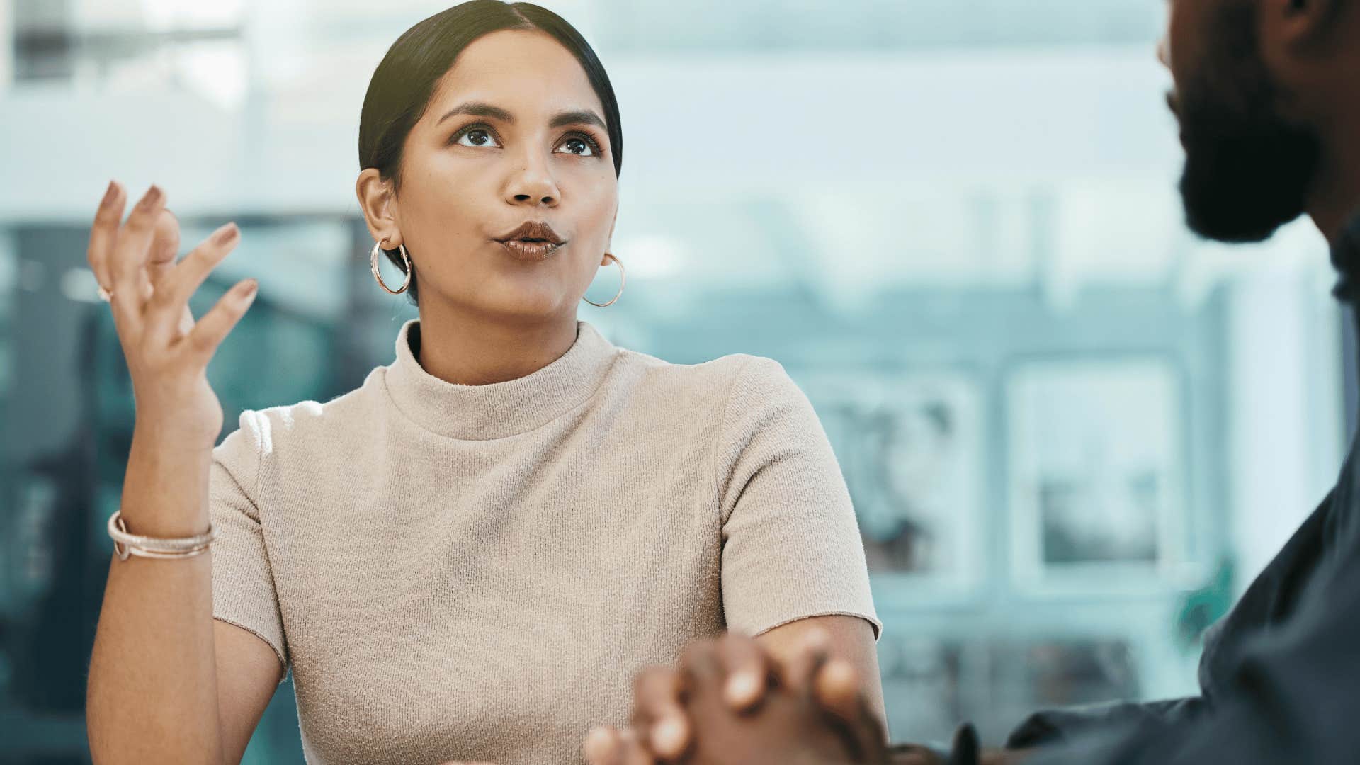 woman setting boundaries with co-worker saying i'm not having this conversation right now