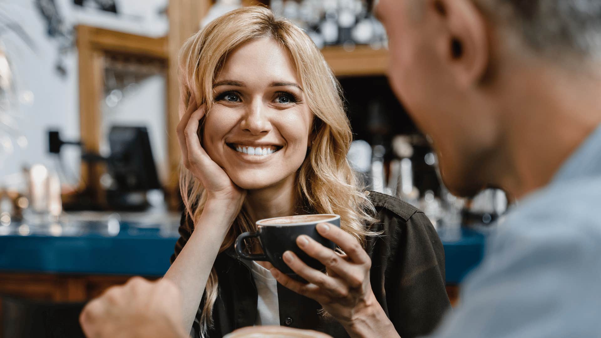 woman in interesting conversation saying tell me more about that