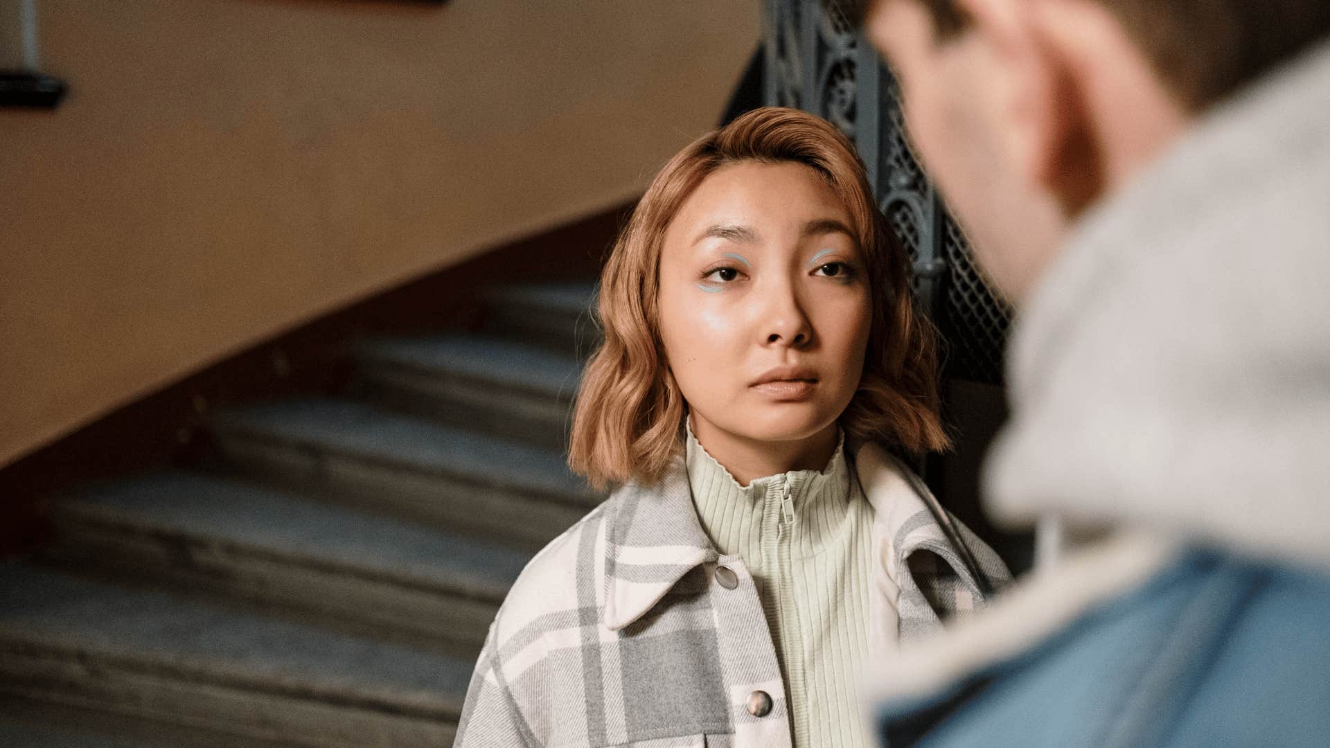 emotionally ugly and numb woman telling friend she doesn't hang out with weak people