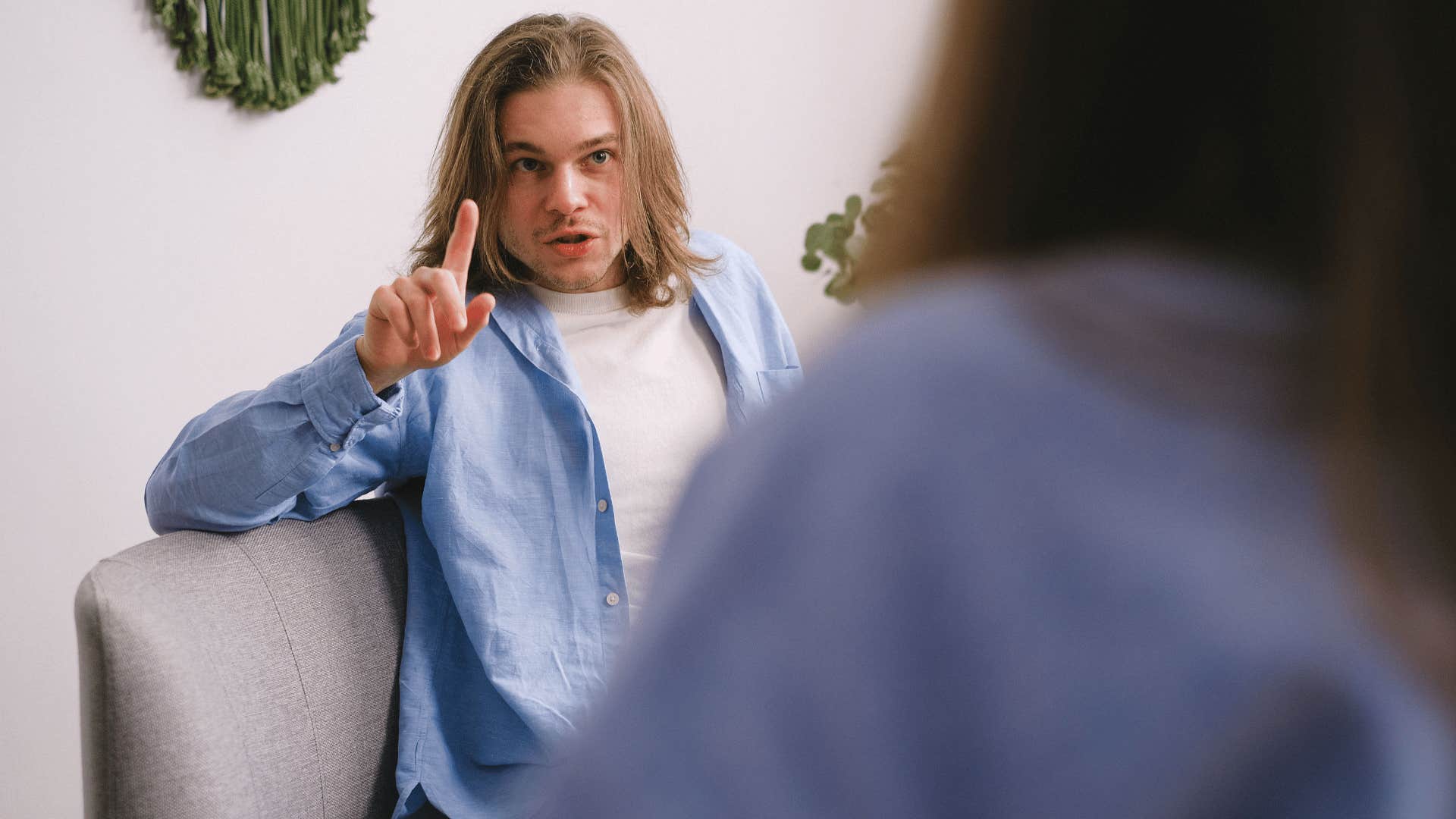 mentally ugly man yelling at friend saying that's not my problem