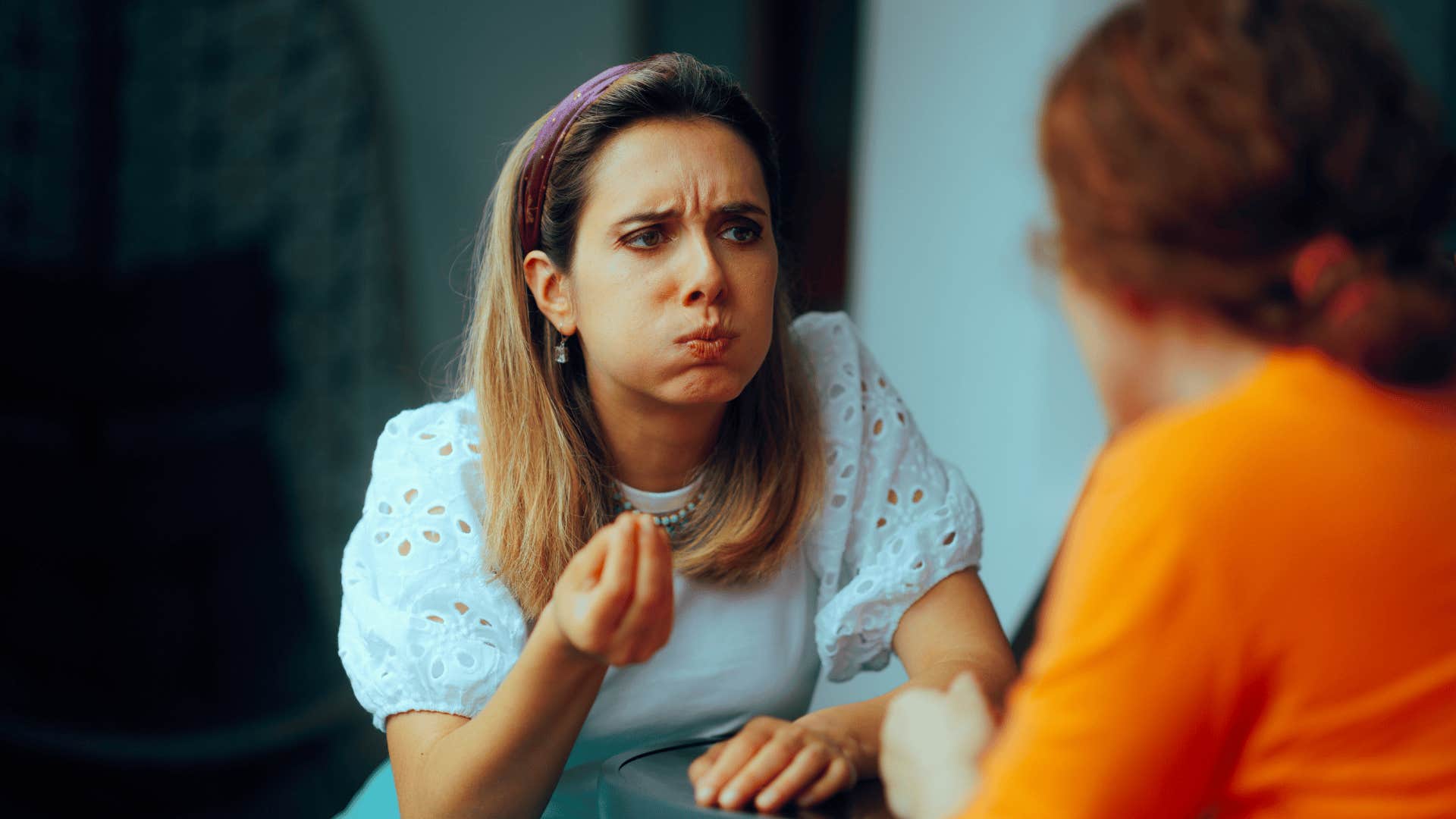 rude woman telling friend she's being emotional