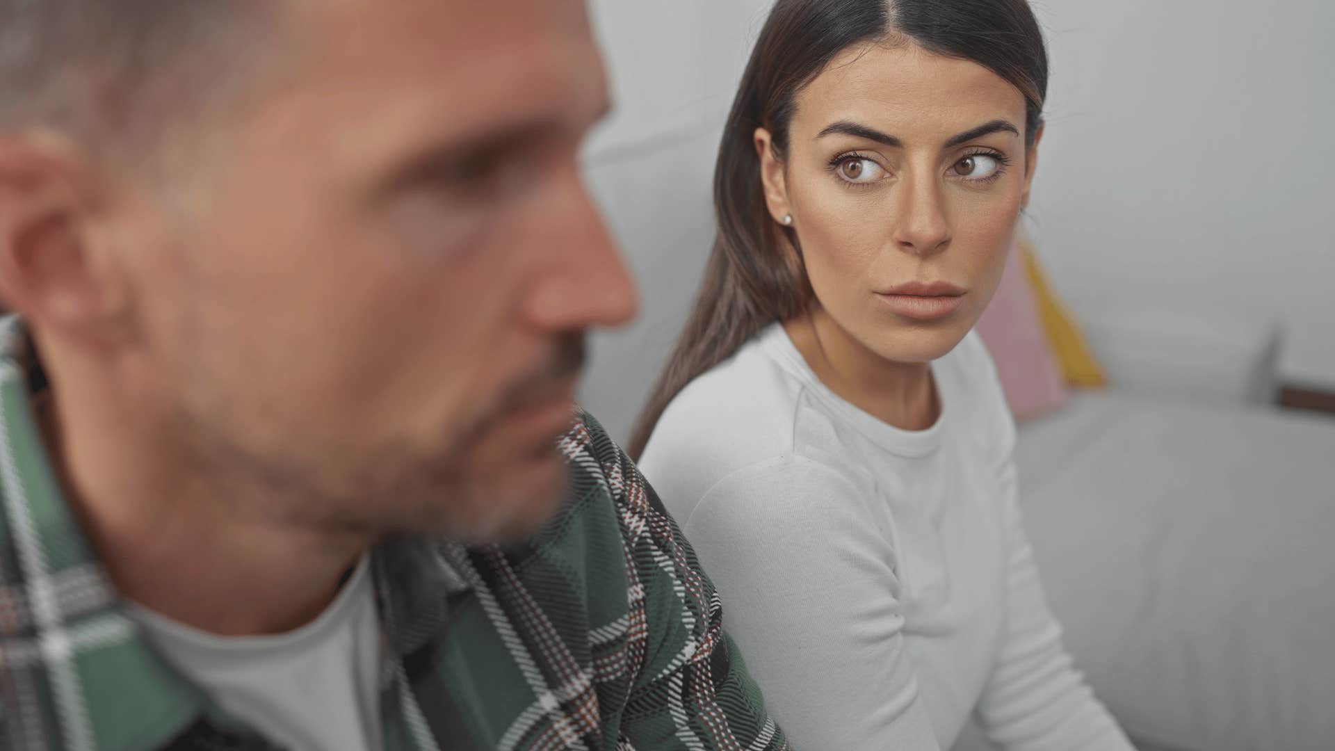 rude woman talking to husband telling him i'm not doing that
