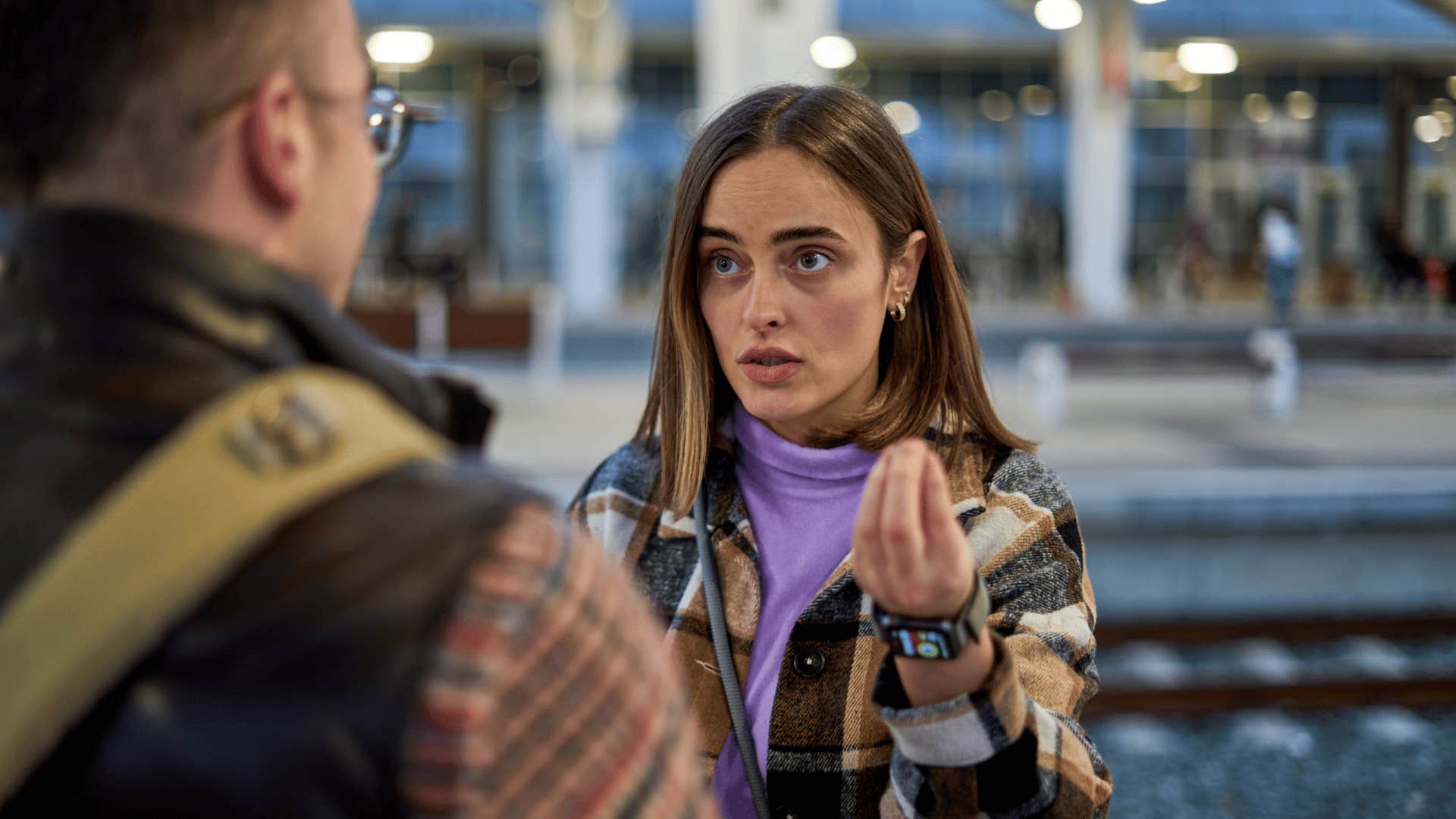 unkind and annoyed woman rudely talking to man saying this isn't fair