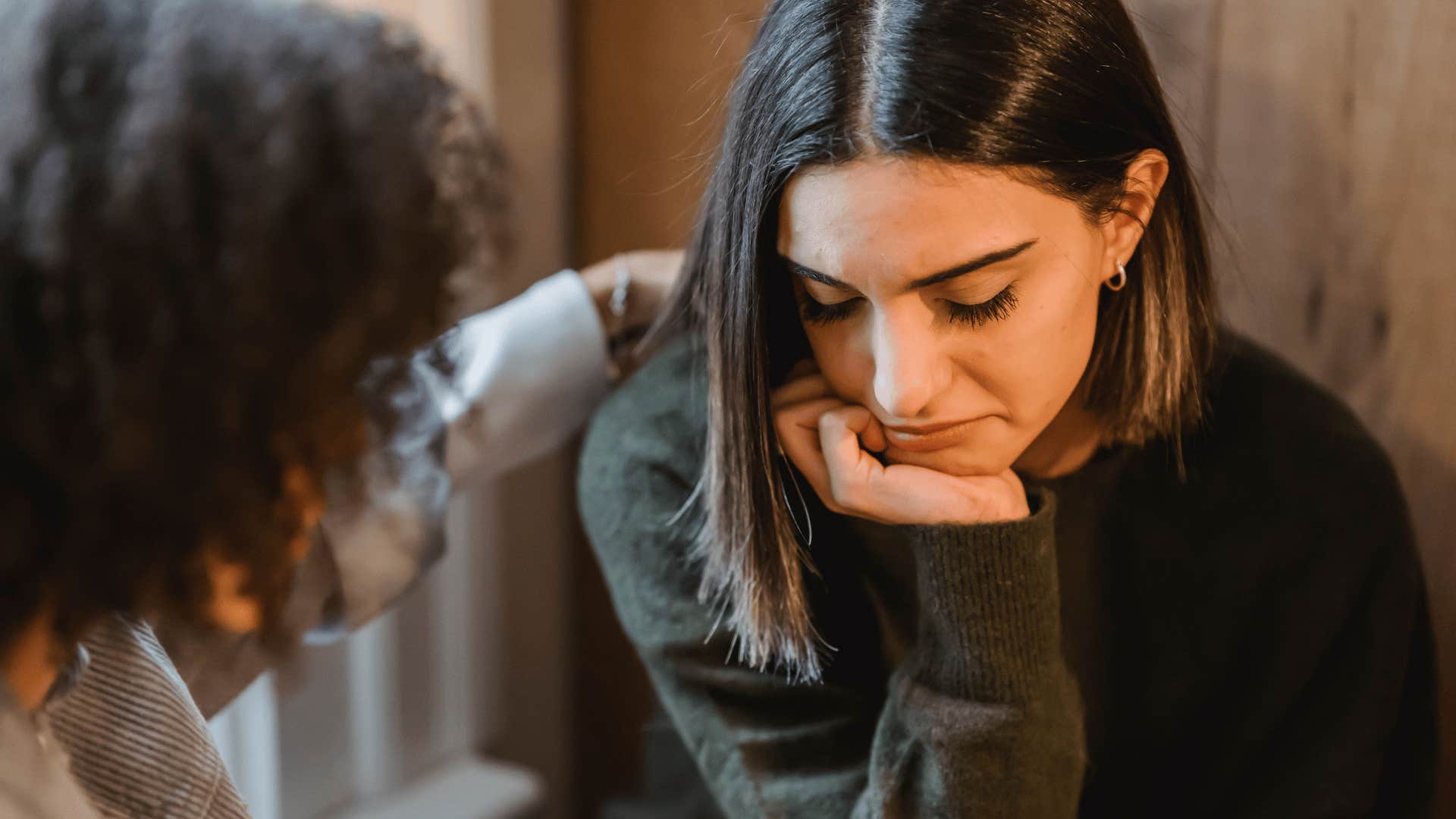 emotionally alone woman telling friend she feels like a burden