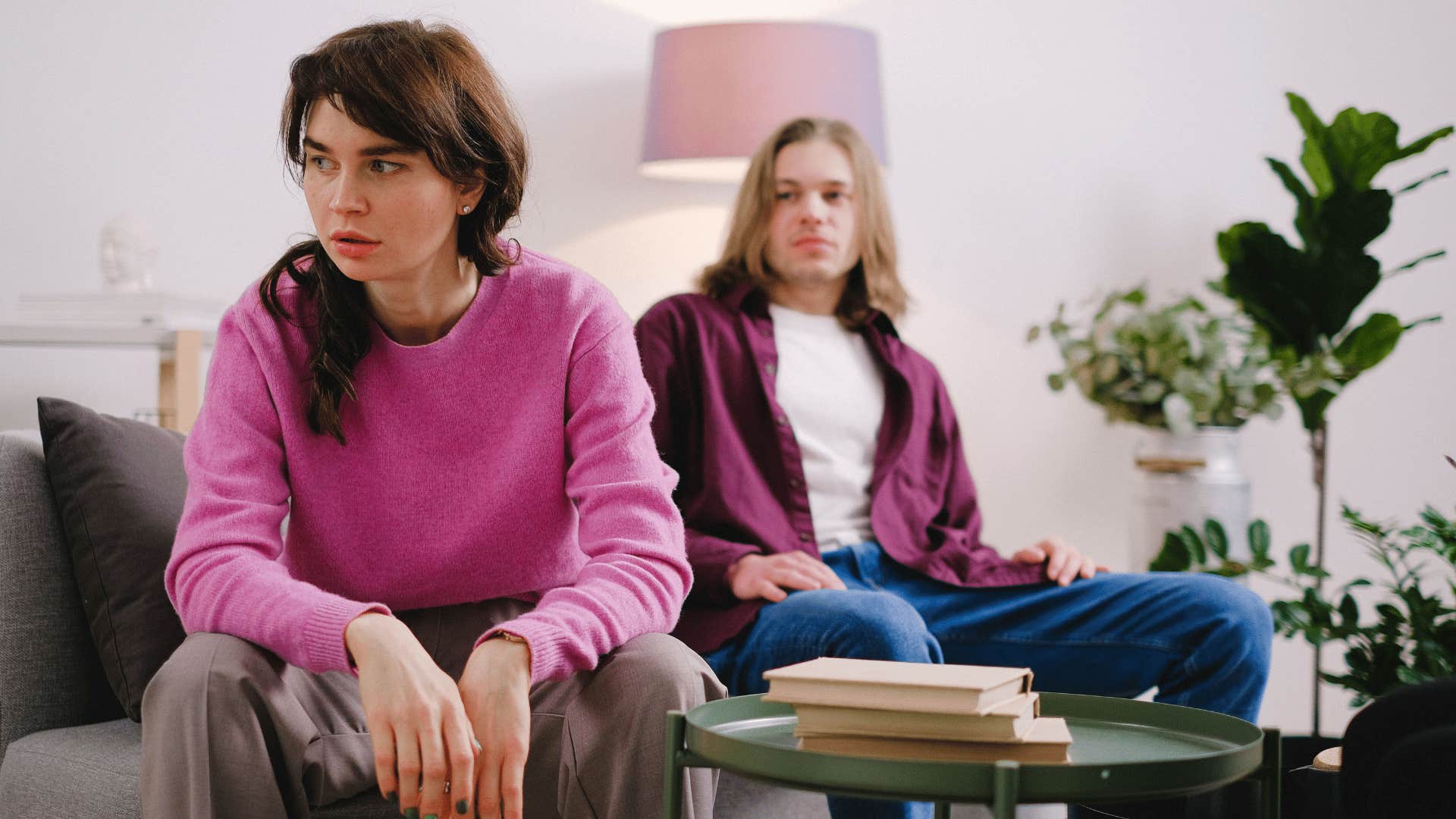 woman feeling mentally and emotionally alone turned away from partner