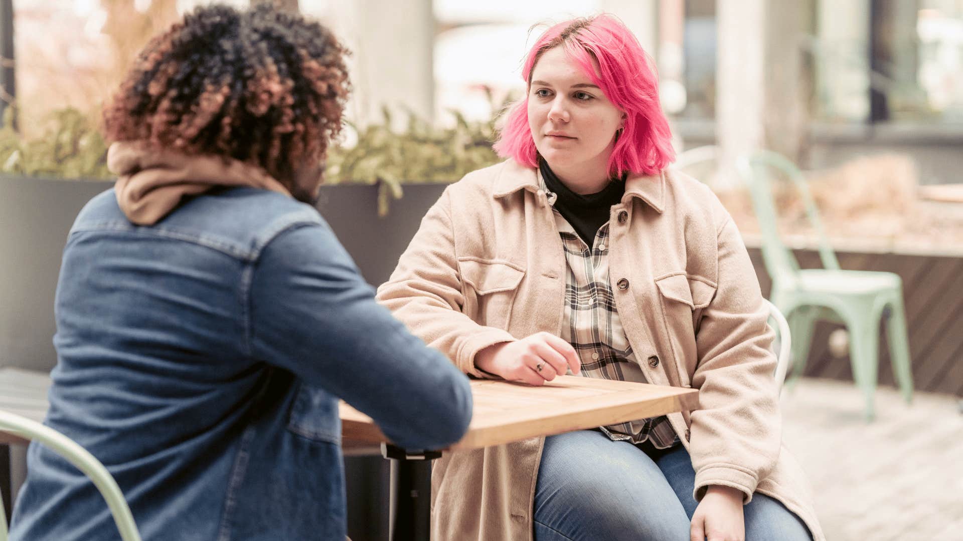 lonely woman talking to friend telling him it's not a big deal