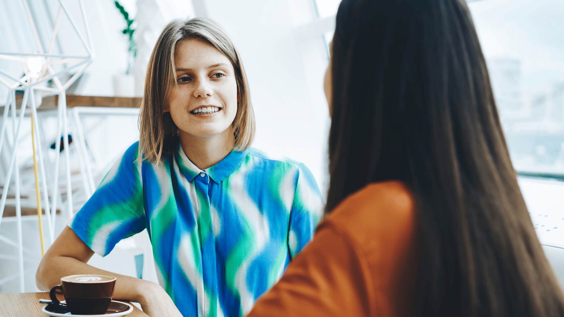 woman giving off creepy vibes talking to colleague saying i notice everything