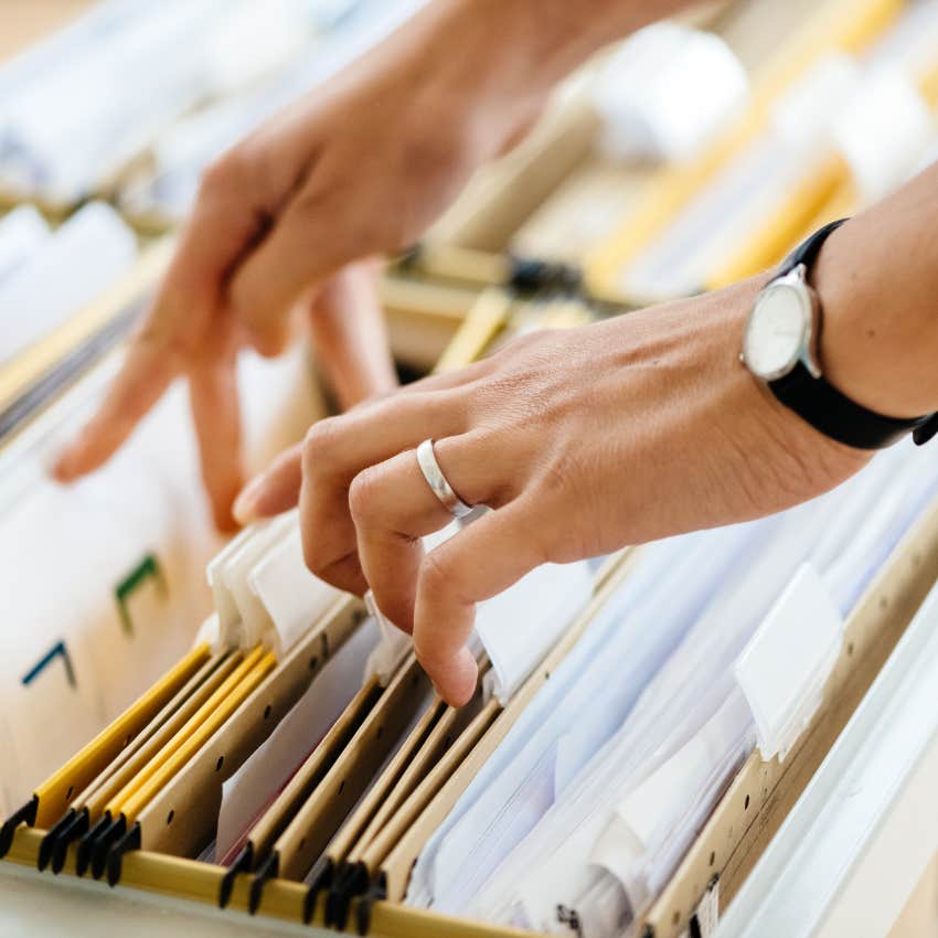 wealthy person using their filing system at home