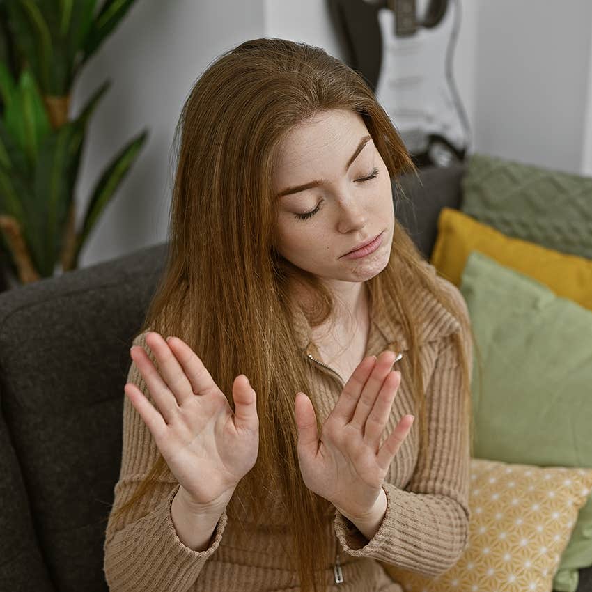woman has self-respect by setting boundaries and putting up hands