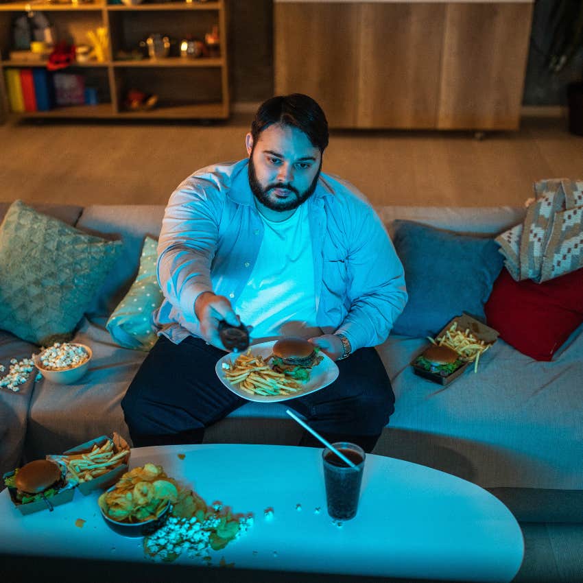 man watching reality tv on his couch