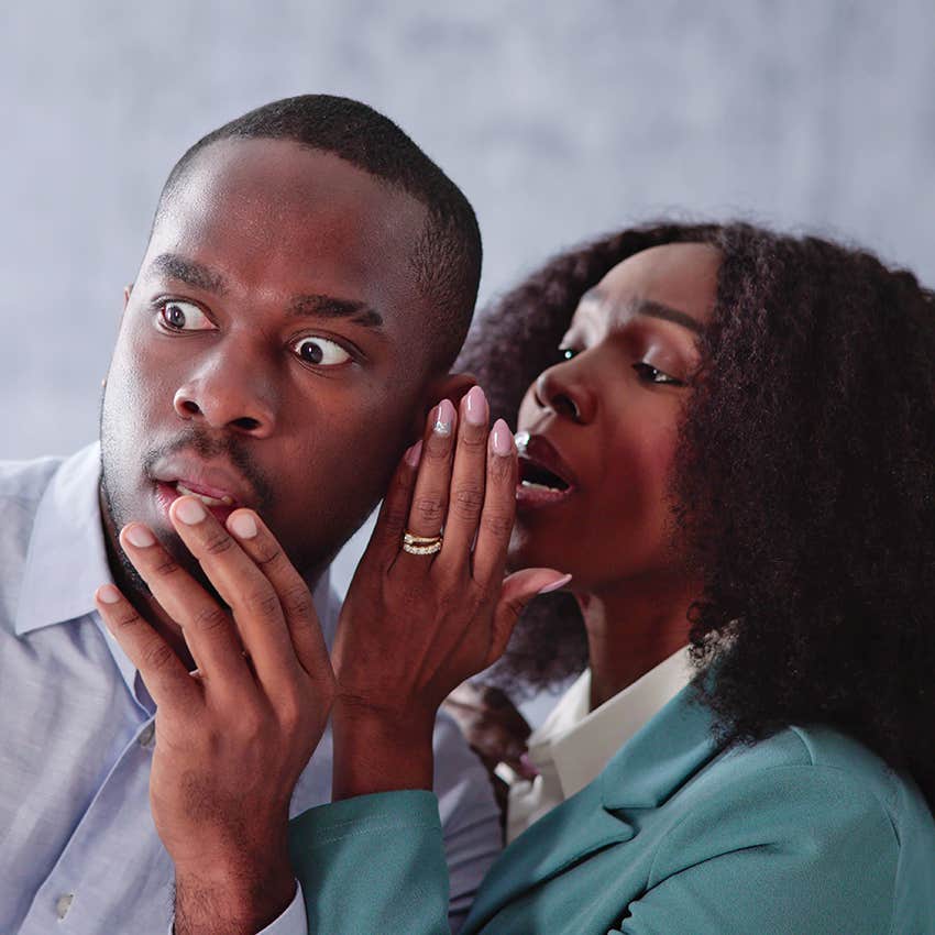 woman sharing disturbing news to shocked man
