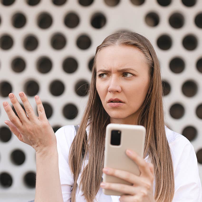 woman frustrated with gossip on phone