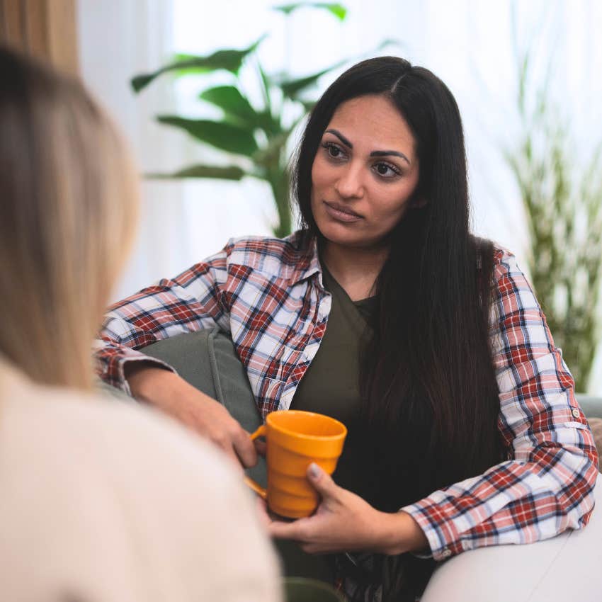 socially awkward woman staring at friend telling her you just don't look great