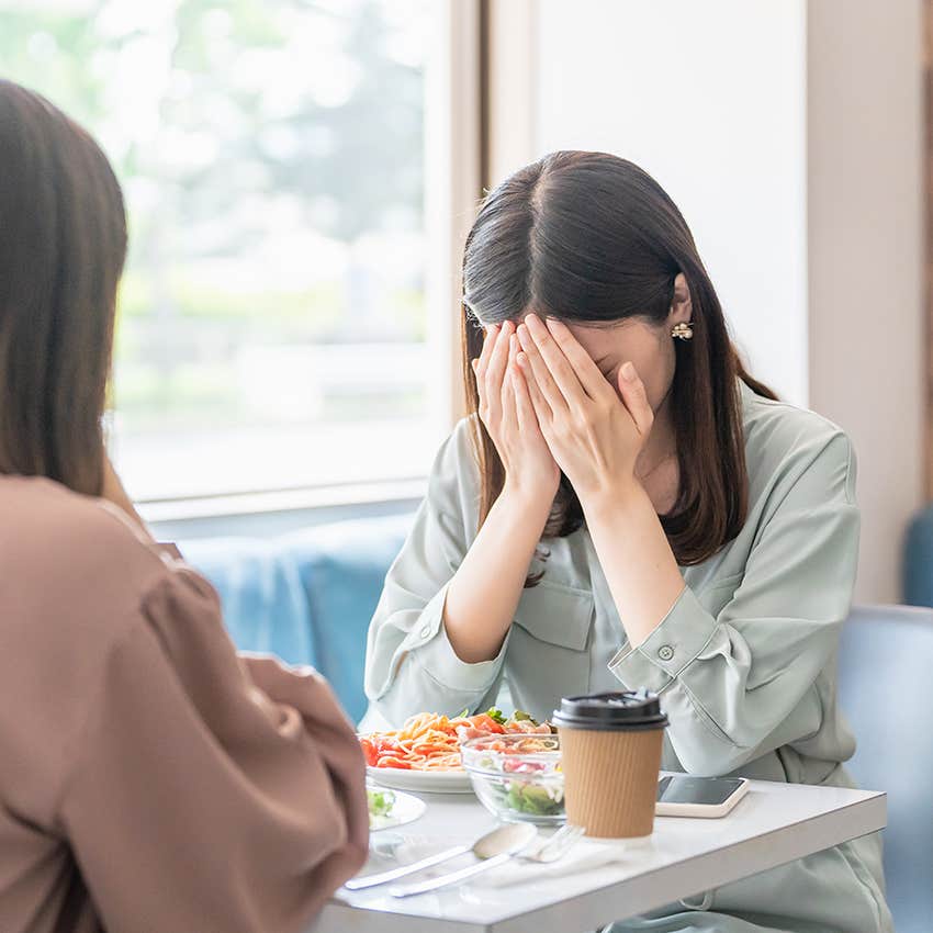 sad woman oversharing to friend over breakfast