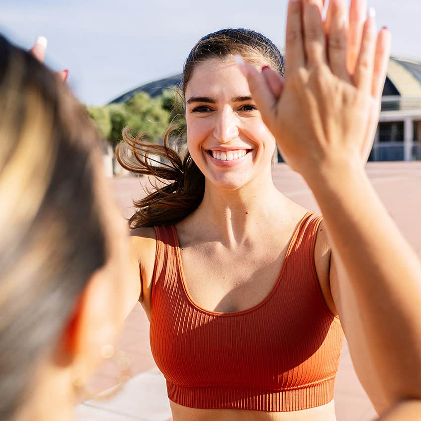 woman congratulating her friend saying she's proud