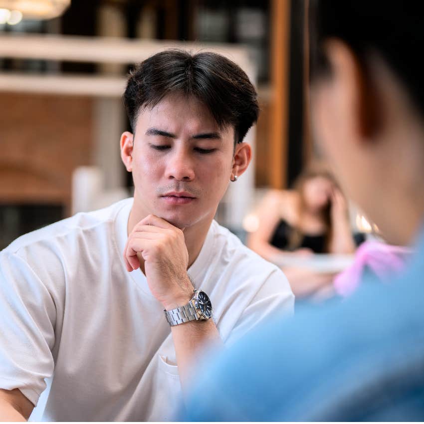 Serious man saying "I'm just tired" to his friend.